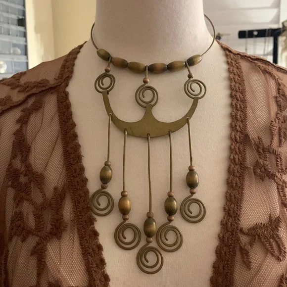 Vintage Handmaid statement piece from the 60s early 70s made of brass& wood